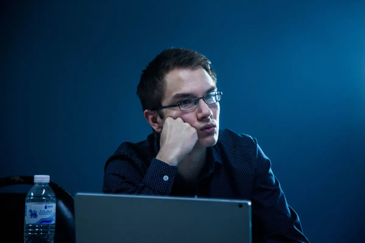 thoughtful person contemplating AI usage