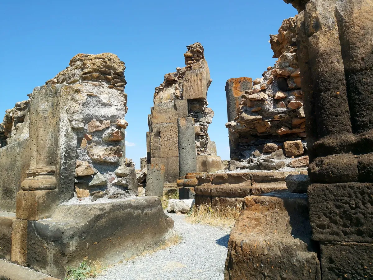 archaeologist examining ruins