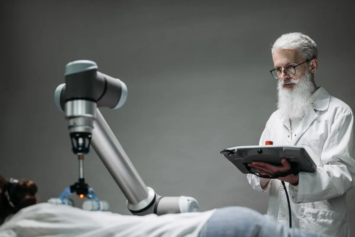 surgeon using robotic technology