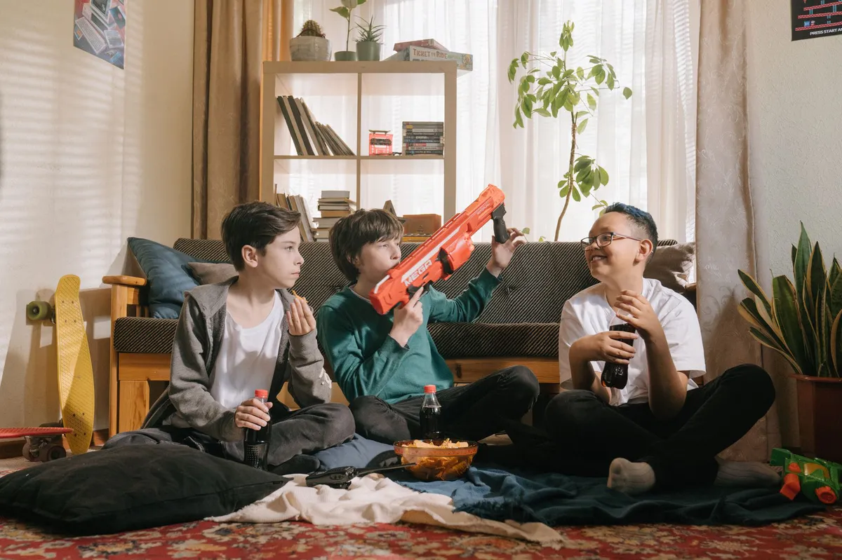 teenagers having fun with toy guns