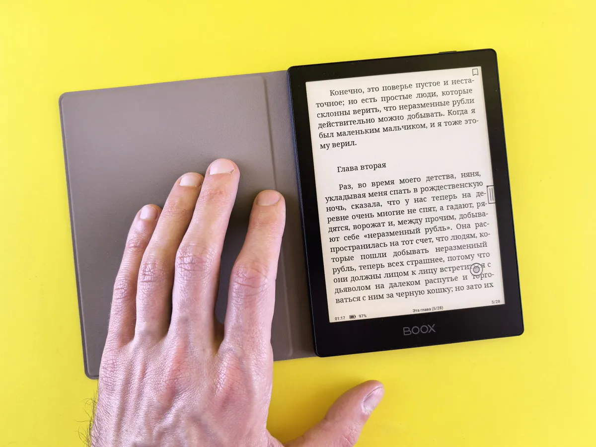 compact e-reader in hand