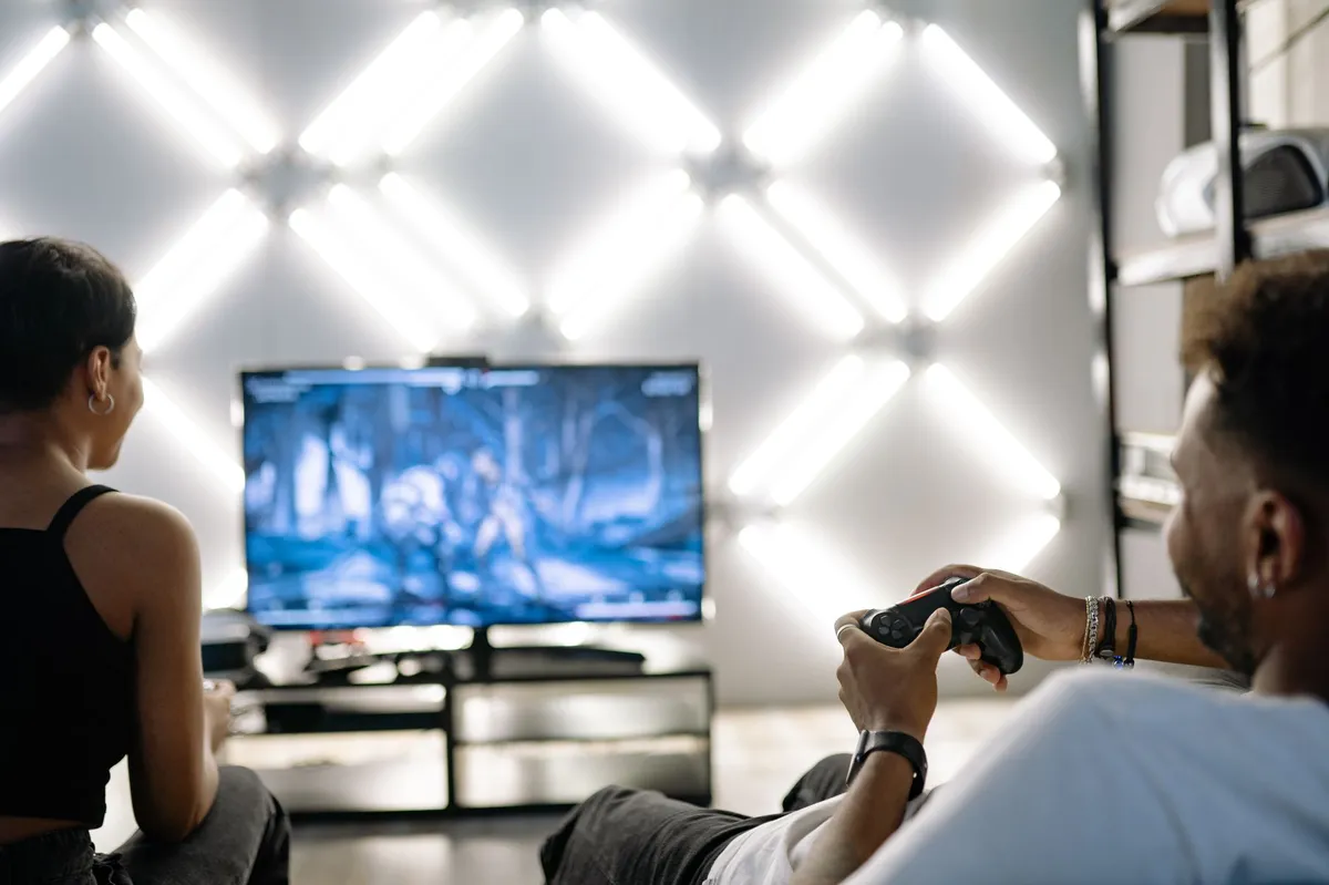 gamer on couch with TV