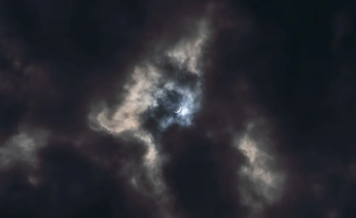 Solar eclipse with clouds
