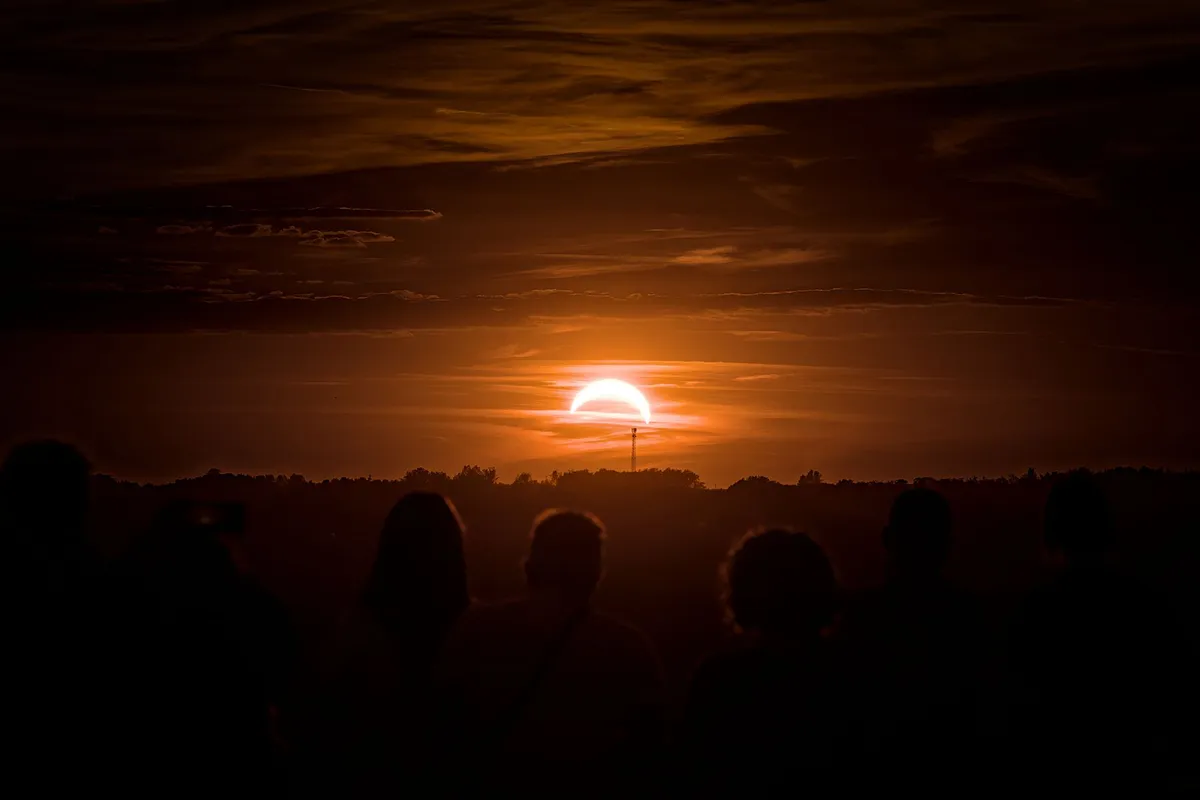 scientists observing solar eclipse