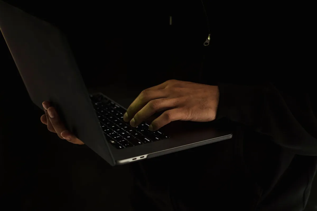 hacker working on laptop