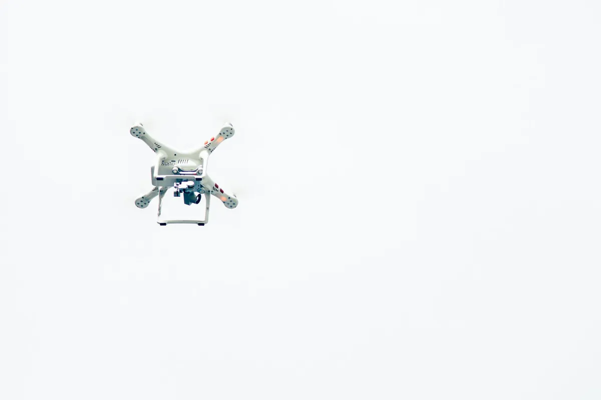 drone hovering above airport