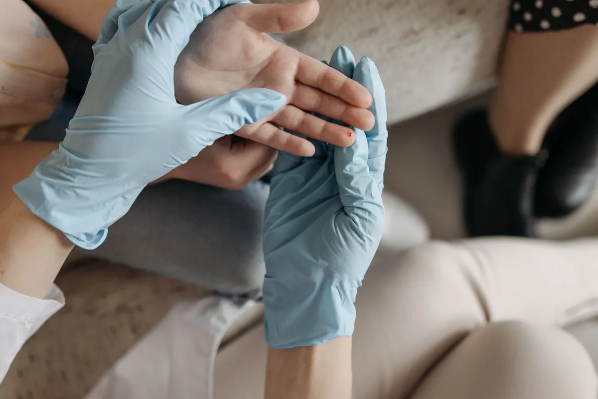 medical professional examining a wound