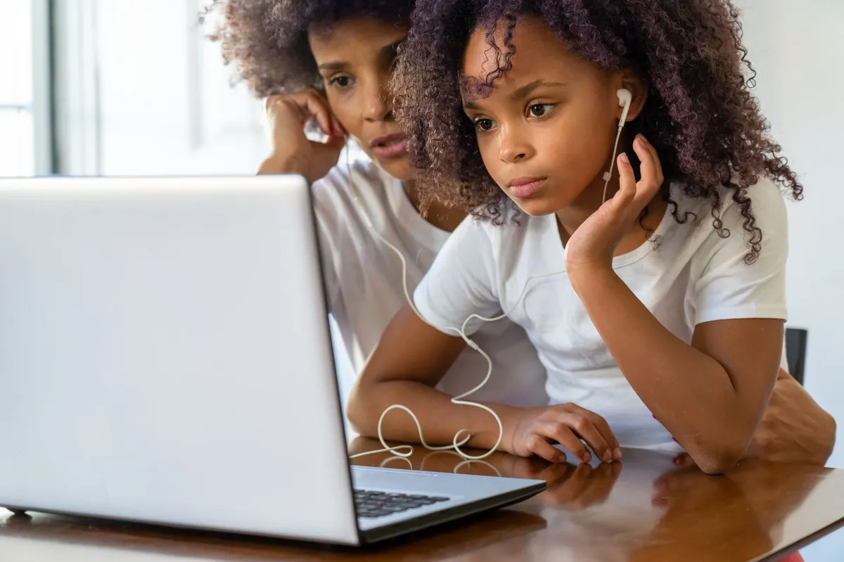 parent and child at computer
