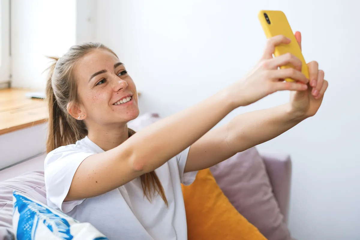 person using smartphone selfie