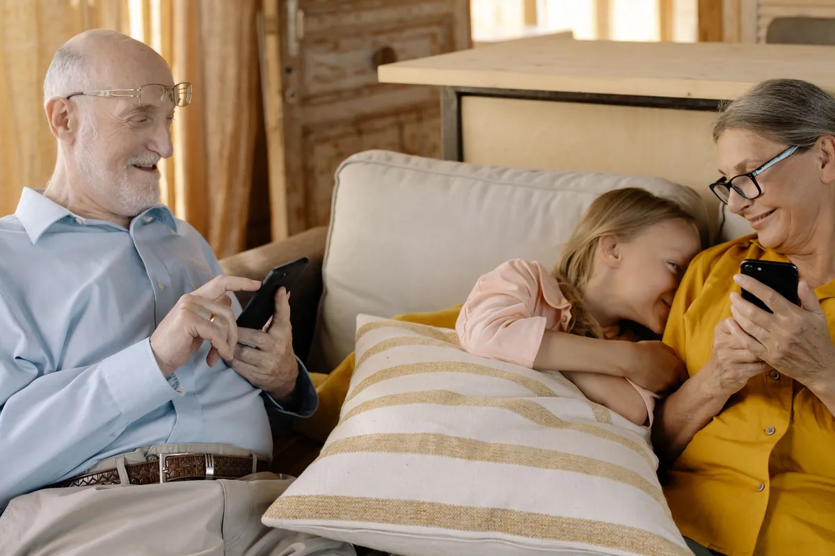 family using smartphone together