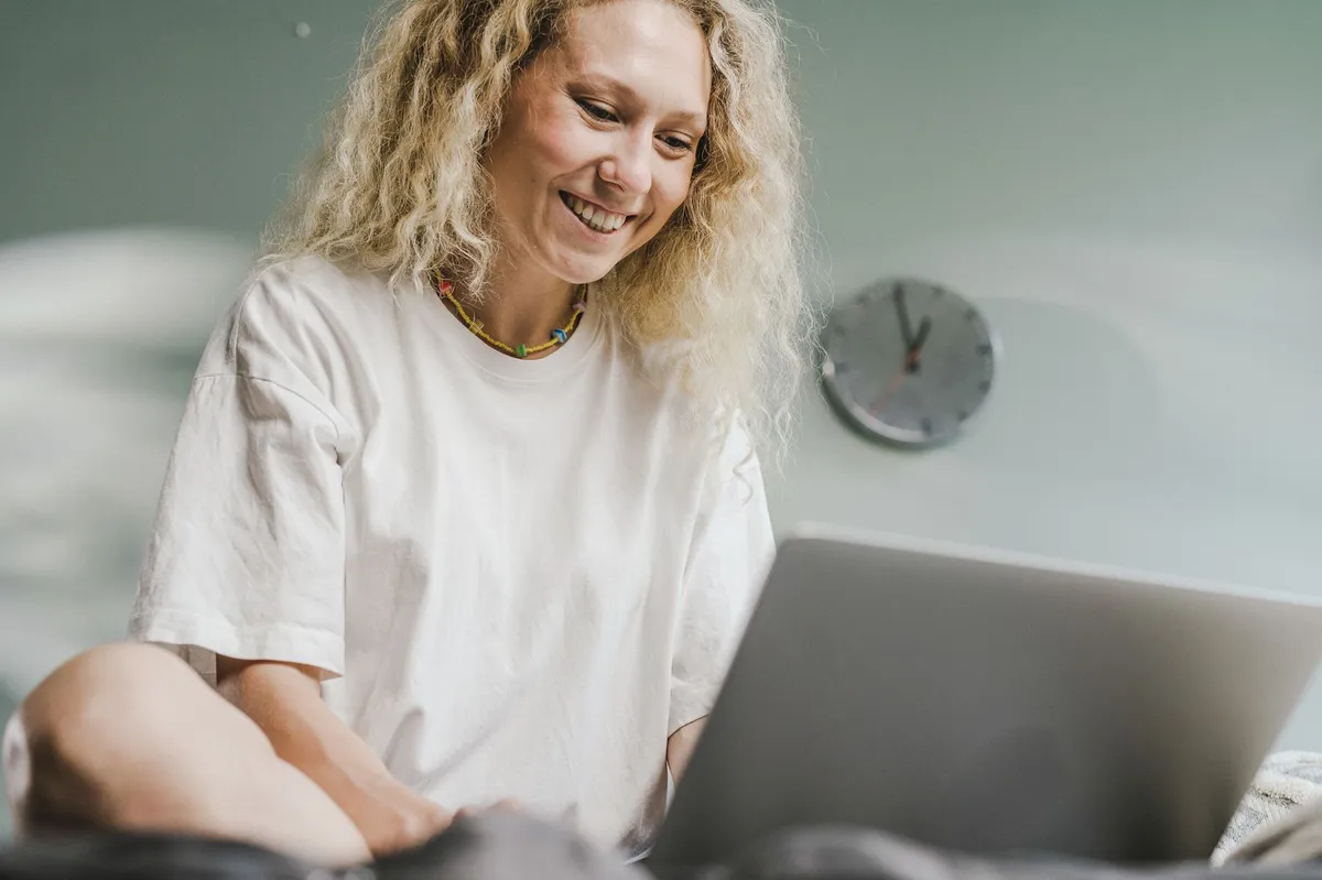 happy person using computer