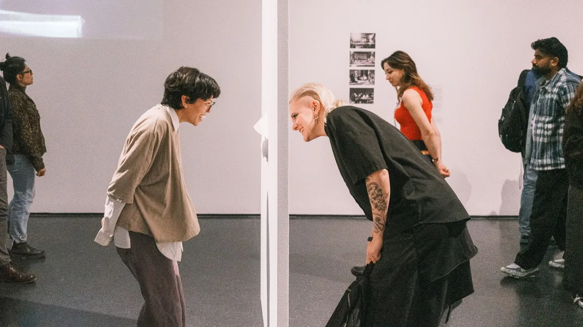diverse museum visitors interacting