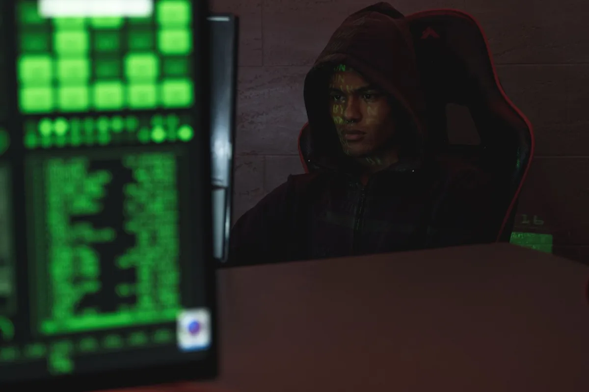 hacker in a dark room