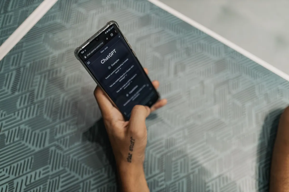 person chatting with AI on smartphone