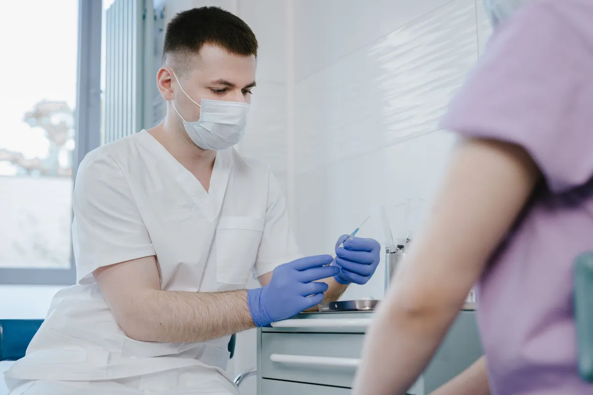 healthcare workers preparing vaccine
