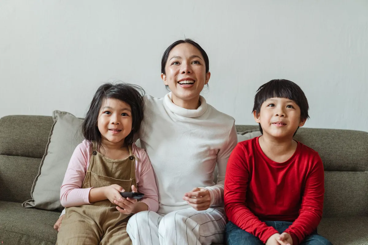 happy family watching TV together