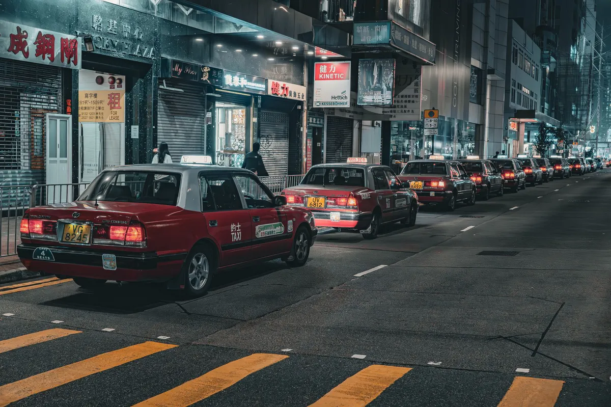 autonomous taxi on city street