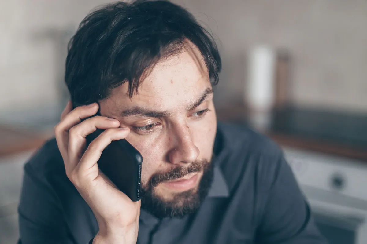 concerned person using smartphone