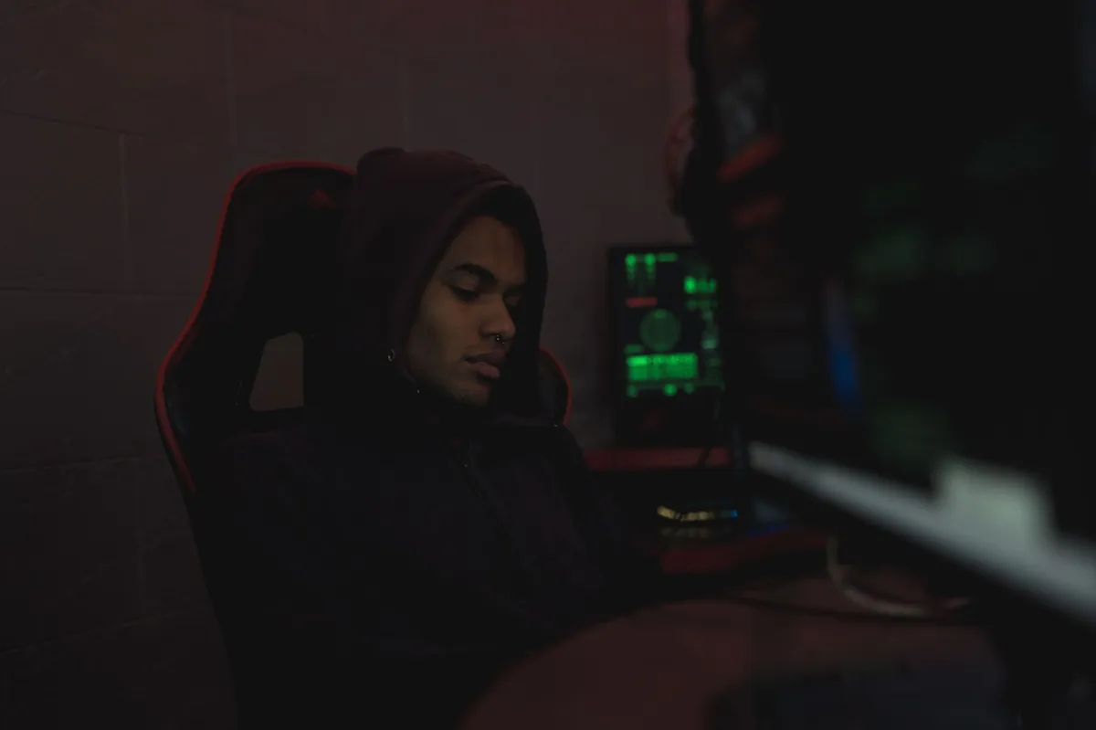 hacker in a hooded sweatshirt