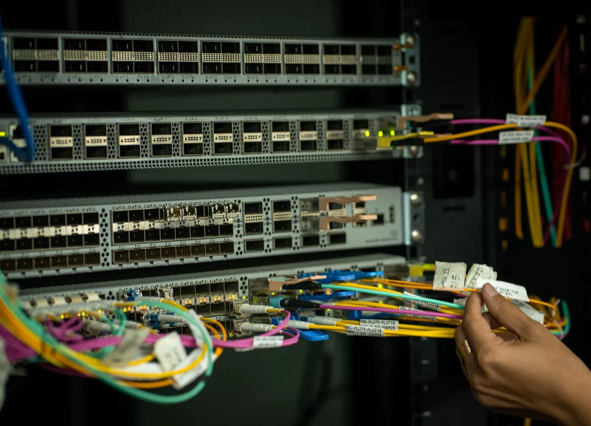 telecommunications worker installing fiber