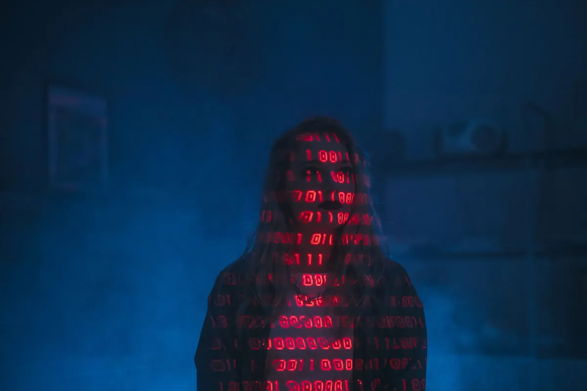 hacker silhouette with coding