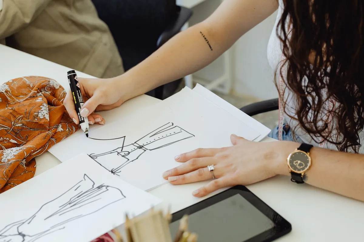fashion designer sketching ideas