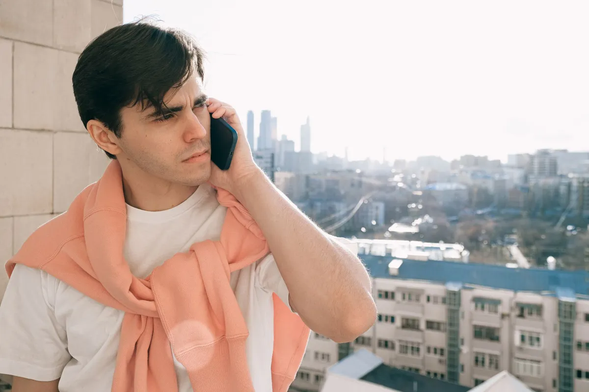 man on phone suspicious