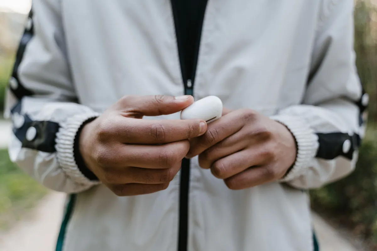 person wearing wireless earbuds