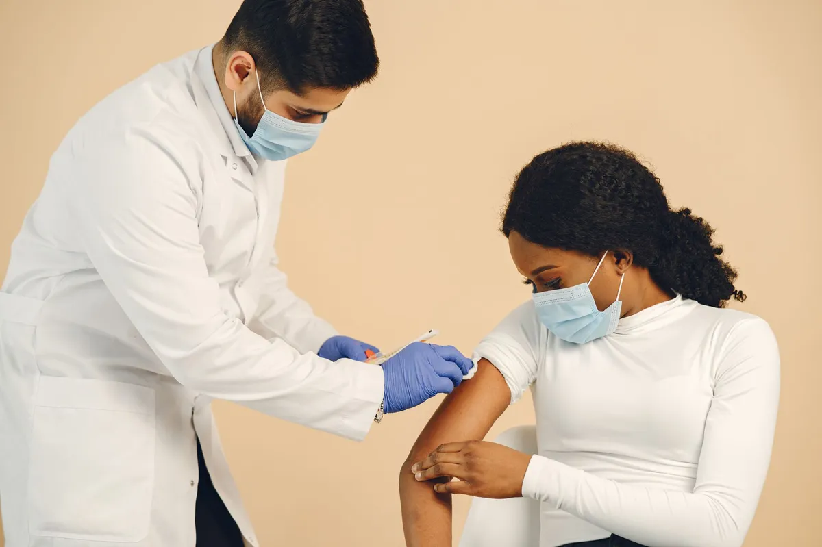 healthcare professional giving vaccine
