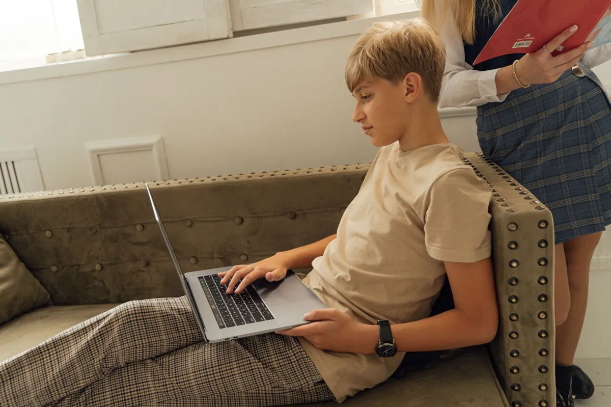teenager using laptop