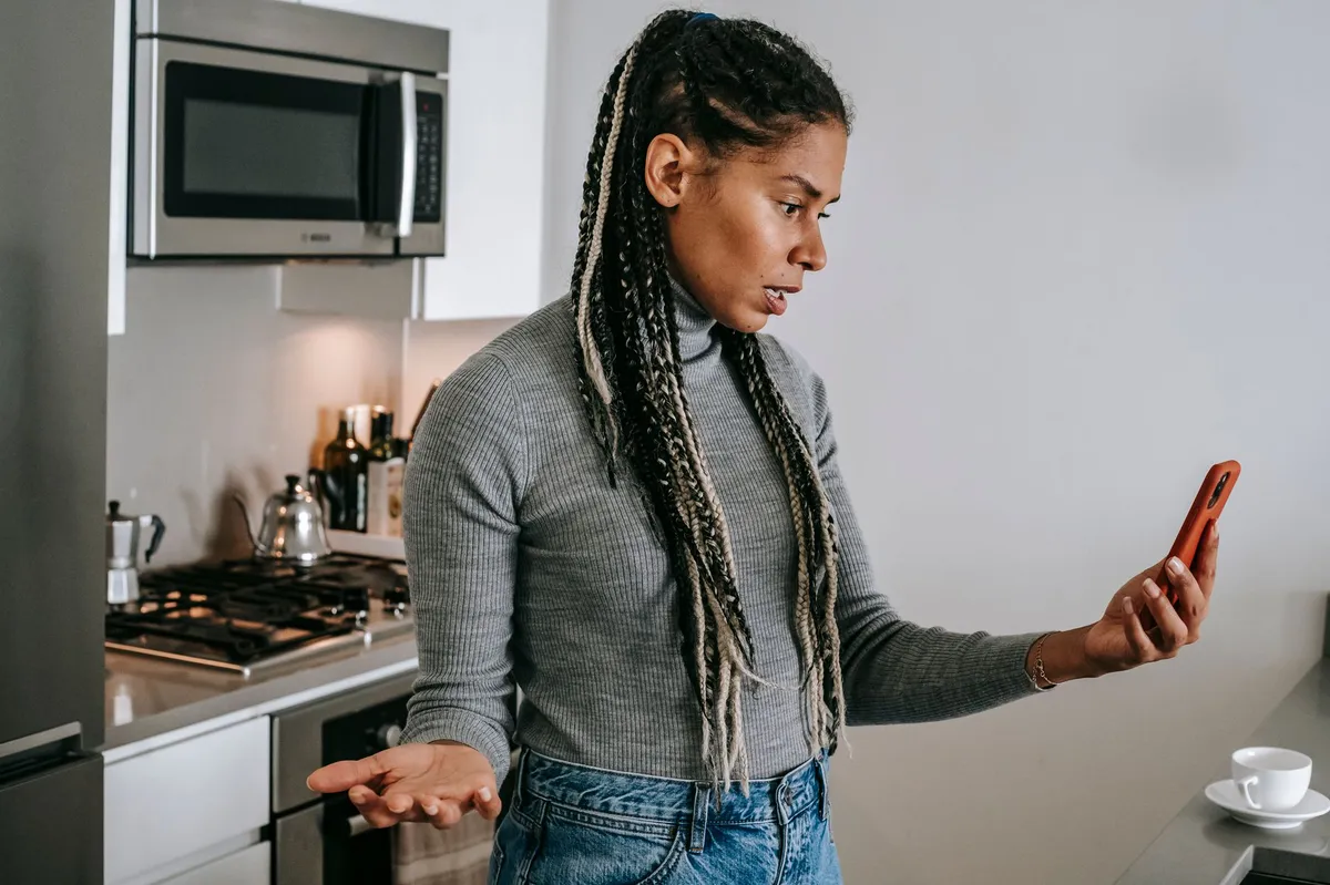 frustrated pet owner with phone
