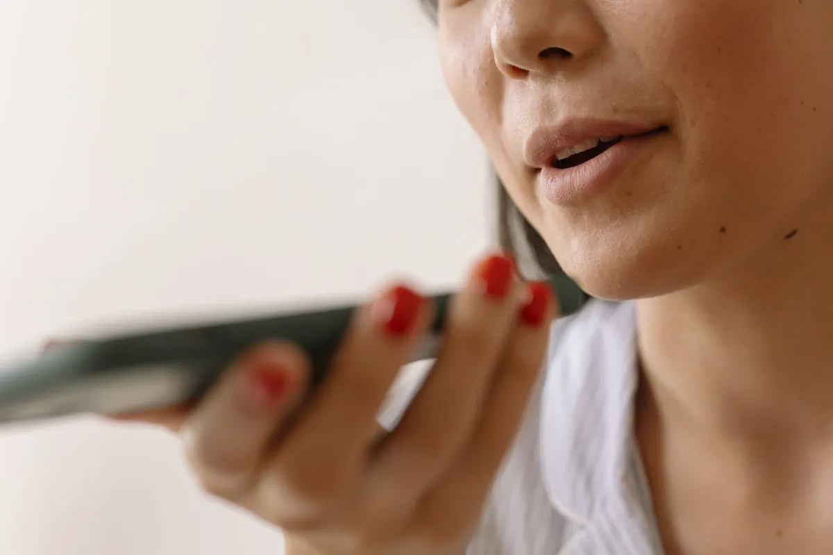 person using voice-activated technology