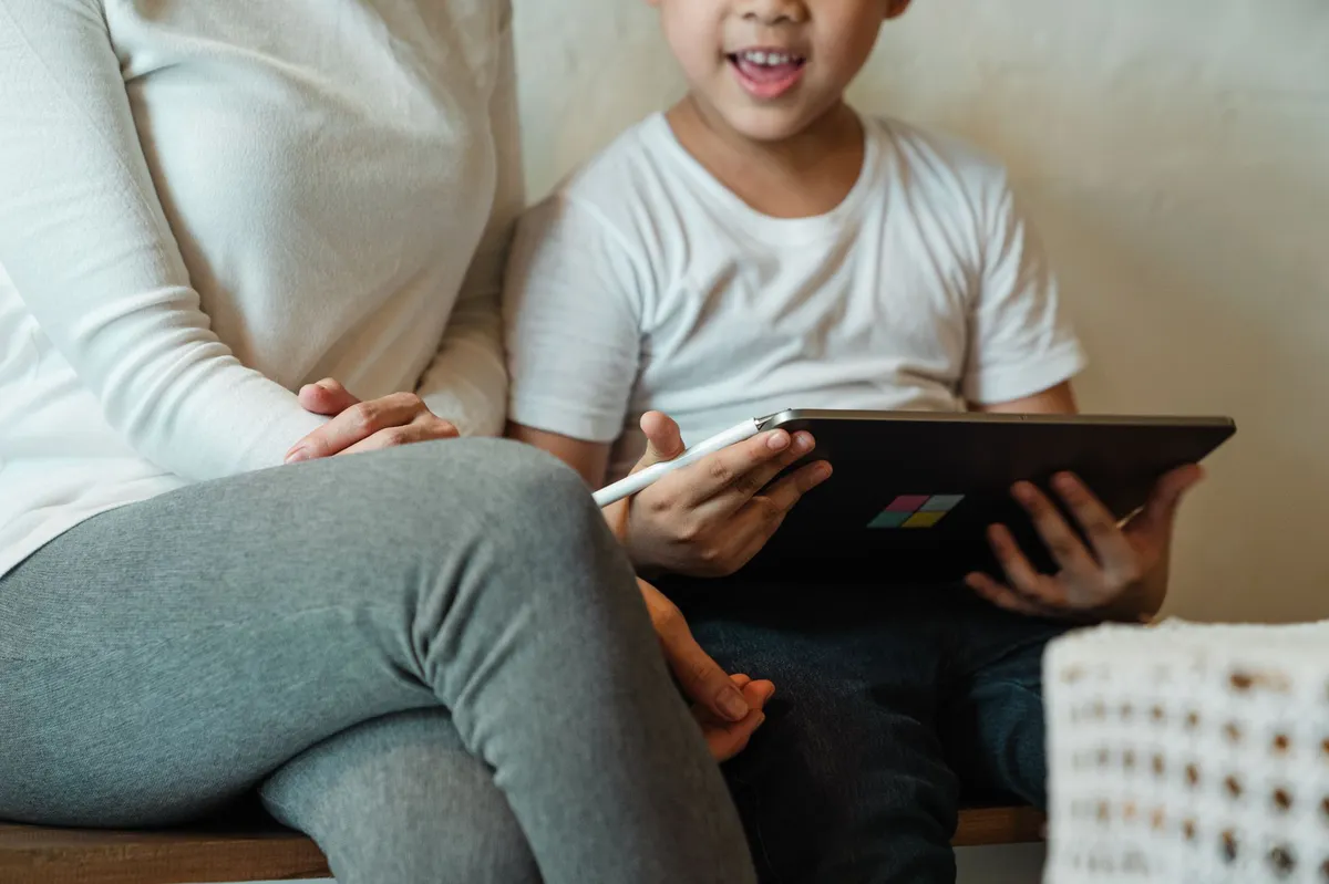 parent and child using tablet