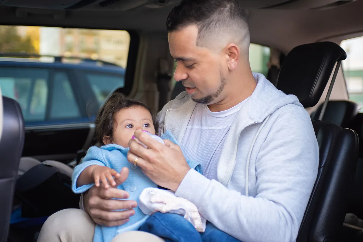 parent monitoring child in car