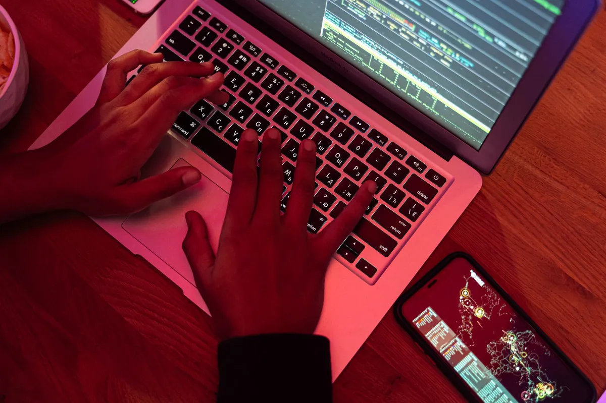 hacker using computer at night
