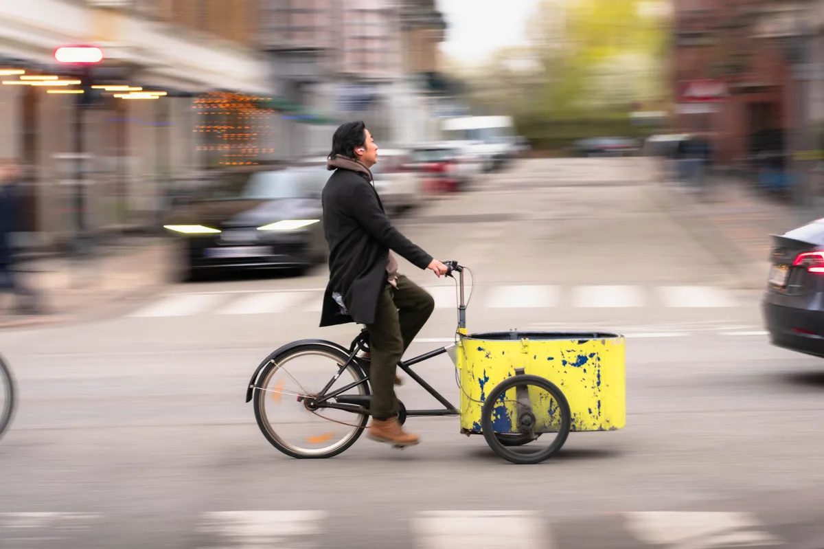 cyclist riding cargo bike